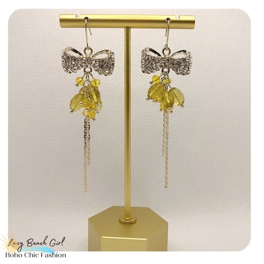 studded bow dangle earrings